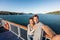 Cruise couple tourists taking selfie on New Zealand travel. People traveling on ferry boat Marlborough sounds taking self-portrait