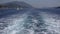 Cruise ferry sailing sea trip boat ship wake, foamy waves traveling to beach
