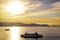 Cruise and ferry tourist boat is traveling accross the bay of Japan with sunlight relection in the background for travel and