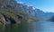 A cruise leaving harbor of Gudvangen to Flam under blue sky and fjord