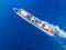 Cruise liner ship across ocean with blue water. Aerial top view. Concept travel tour