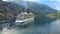 Cruise liner ship swimming at blue adriatic sea on mountains landscape port of Kator, Montenegro. KOTOR, MONTENEGRO -