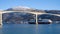 Cruise service vessel Hurtigruten under the Finnsnes bridge