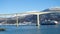 Cruise service vessel Hurtigruten under the Finnsnes bridge Troms