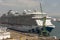 Cruise ship on berth with a background of fuel tanks. Le Havre, France.