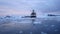 Cruise ship in calm waters of Deception Bay, Antarctica at twilight