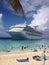 Cruise Ship-Carnival Victory docked by the beach.