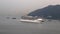 A cruise ship crosses Tung Wan Bay near the Ma Wan Island, Hong Kong