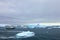 Cruise ship crusing around ice floes in Antarctic waters