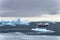Cruise ship crusing around ice floes in Antarctic waters