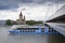 Cruise ship on Danube with St. Francis of Assisi Church on Mexikoplatz on 7 May 2012 in Vienna, Austria