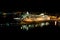 Cruise ship docked at ocean terminal at night