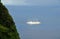 Cruise ship emerges from behind mount Piton