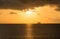 Cruise ship on horizon at sunset