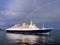 Cruise Ship Leaving Port Below Rainbow.