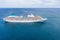 Cruise ship liner sails in the blue sea leaving a plume, seascape. Aerial view The concept of sea travel, cruises