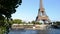 Cruise ship moving on Seine river near the Eiffel Tower in Paris.