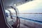 Cruise ship Open deck with Rescue Lifeboats and life buoy through the Window in raindrops