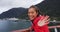 Cruise ship passenger in Alaska city of Ketchikan standing on cruise ship deck