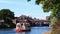 A cruise ship on the river Ouse in the centre of York, Northern England