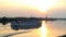 cruise ship running to the west at sunset photo landscape