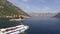 Cruise ship sails on the Kotor Bay past St. George Island