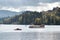 Cruise ship and speedboat on lake