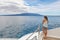 Cruise ship tourist on luxury yacht boat looking at Galapagos Islands landscape