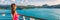 Cruise ship tourist woman Caribbean travel vacation banner. Panoramic crop of girl enjoying sunset view from boat deck leaving