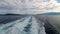 Cruise ship track with calm sea and cloudy sky in the morning at the Aegean Sea.