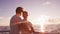 Cruise ship travel vacation video. Couple enjoying view of sunset sailing on small cruise boat at sea. Romantic couple