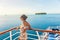 Cruise ship travel vacation woman looking at ocean from deck of sailing boat. Luxury Tahiti Bora Bora French Polynesia