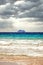 Cruise ship under dramatic sun clouds mix on the sea of atlantic ocean