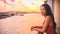 Cruise ship vacation Asian woman relaxing on boat deck luxury getaway travel sunset Caribbean tropical winter