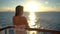Cruise ship vacation travel woman enjoying sunset at sea on boat