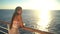 Cruise ship vacation woman enjoying sunset at sea