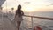 Cruise ship vacation woman enjoying sunset at sea