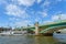 A cruise tourist boat passing under the Southwark bridge