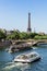 Cruise tourist ships with the Invalides Bridge and the Eiffel To