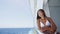 Cruise woman enjoying luxury travel lifestyle from cruise ship balcony