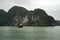 Cruising among beautiful limestone rocks and secluded beaches in Ha Long bay, UNESCO world heritage site