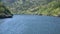 Cruising through narrow gorge or canyon on the Douro river near the Carrapatelo dam in northern Portugal