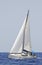 Cruising sailboat speeding at open sea