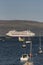 Cruising through the Scottish isles. Cruise ship at anchor at Portree, Scotland.
