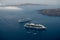 Cruising ship on Santorini island in summer time on Aegean sea