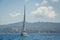 Cruising yacht in a blue waters of Mediterranean sea, Sardinia island.