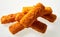 Crumbed fried fish fingers sticks on white