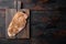 Crumbed uncooked chicken breast ingredient on wooden table, top view with space for text