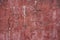 Crumbling ancient faded red painted stucco plaster wall abstract horizontal background texture