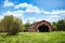 A crumbling large barn in the countryside